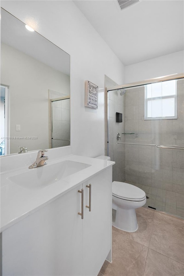 29081 SW 168th Ct, Homestead, FL 33030 - full bathroom with toilet, a shower stall, vanity, and tile patterned flooring