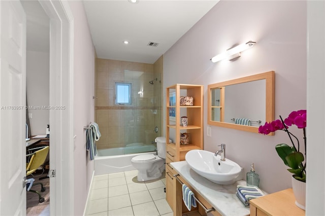 bathroom featuring tile patterned flooring, visible vents, washtub / shower combination, toilet, and vanity