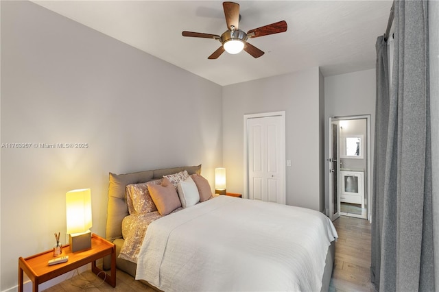 bedroom featuring a ceiling fan and wood finished floors