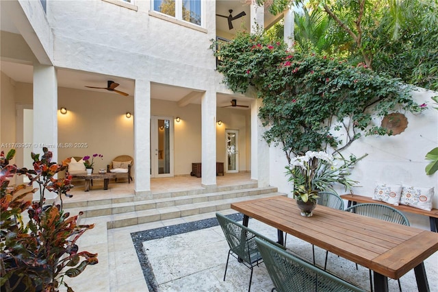 view of patio featuring outdoor dining space and ceiling fan