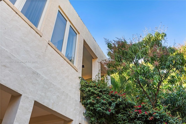 view of side of property featuring stucco siding