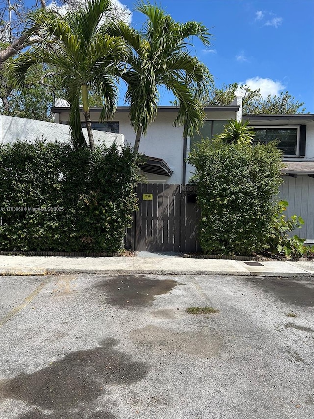 view of side of property with uncovered parking