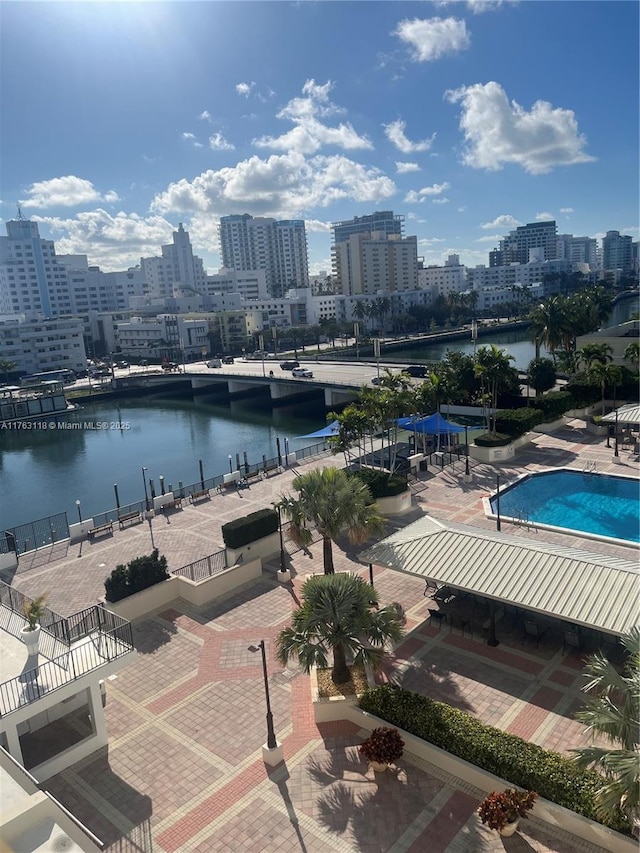 exterior space with a water view and a city view