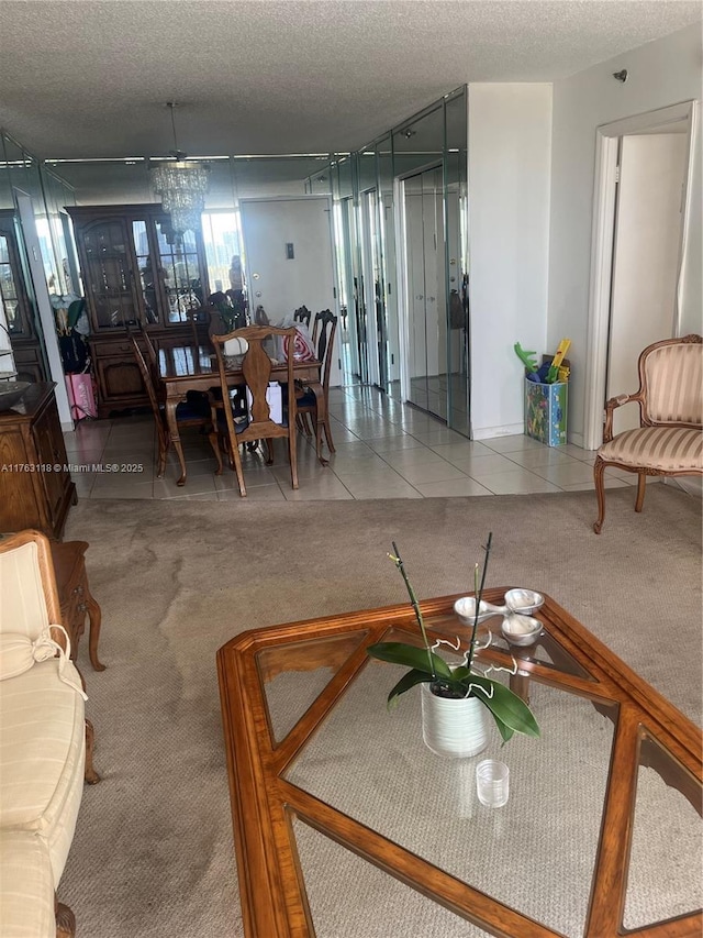 dining room featuring tile patterned flooring, carpet flooring, and a textured ceiling