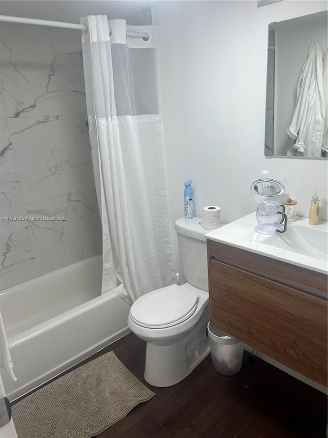 full bathroom featuring shower / bathtub combination with curtain, toilet, vanity, and wood finished floors