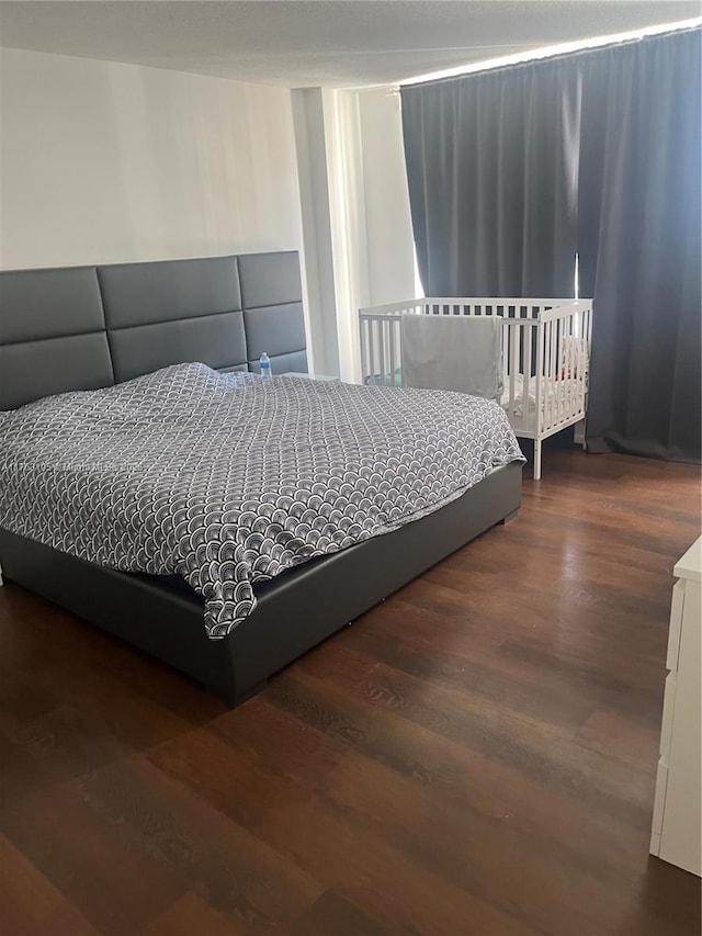 bedroom featuring wood finished floors