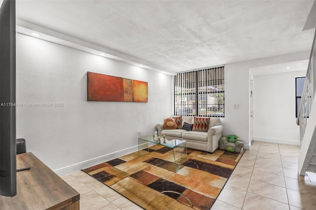 tiled living room with baseboards