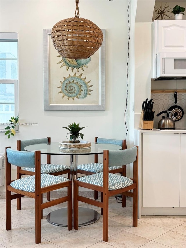 dining space with light tile patterned floors