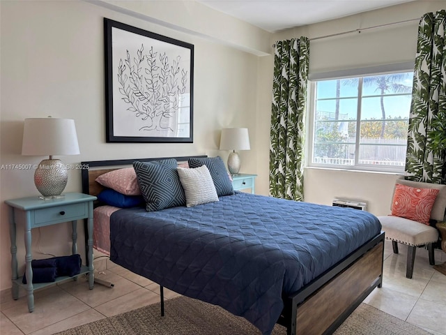 bedroom featuring light tile patterned flooring