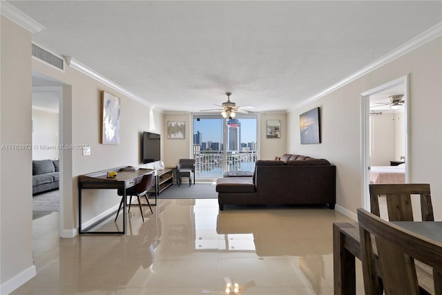 living area featuring visible vents, baseboards, crown molding, and a ceiling fan