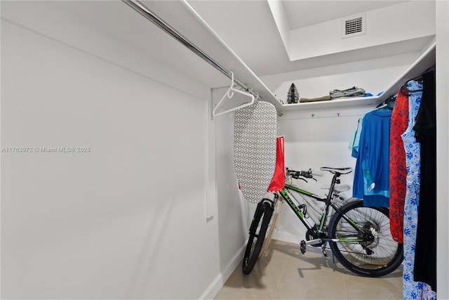 walk in closet featuring visible vents and tile patterned flooring