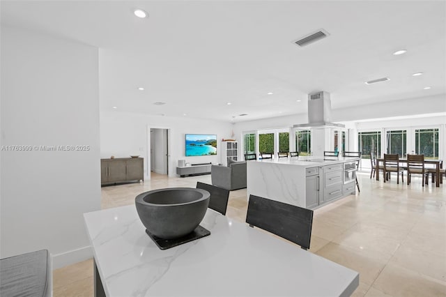 dining room with recessed lighting, visible vents, and baseboards