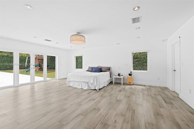 unfurnished bedroom with recessed lighting, visible vents, light wood-style flooring, and french doors