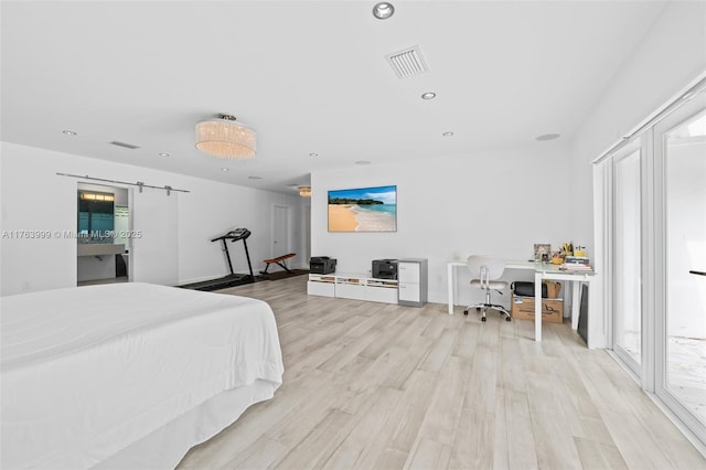 bedroom featuring visible vents, multiple windows, light wood-style floors, and recessed lighting