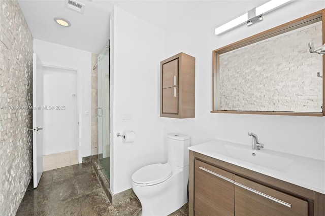 full bath with visible vents, toilet, a stall shower, and vanity