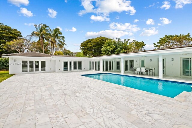 pool featuring a patio area and french doors