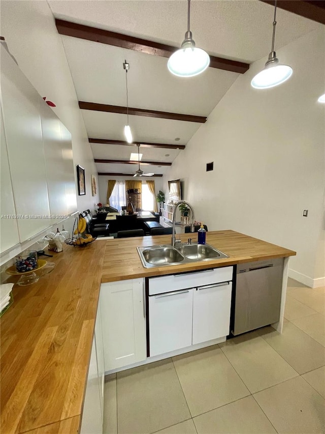 kitchen with butcher block countertops, a sink, white cabinets, dishwasher, and ceiling fan