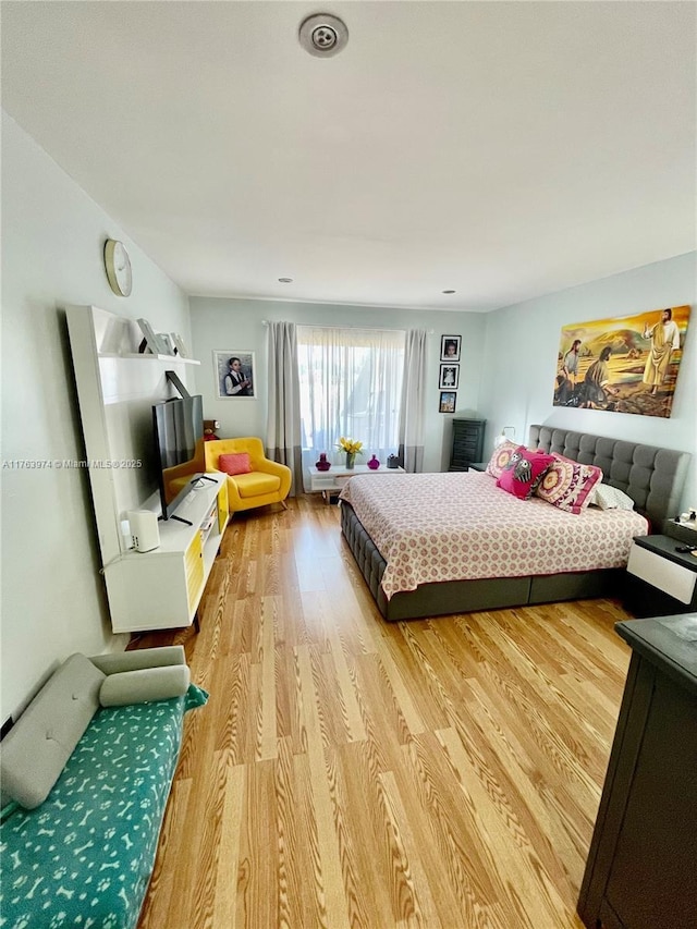 bedroom with light wood-type flooring