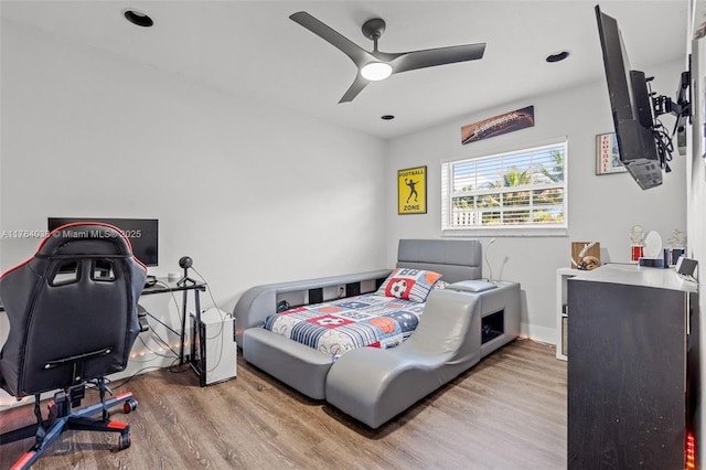 bedroom featuring wood finished floors and a ceiling fan