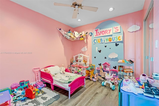 bedroom with a ceiling fan, recessed lighting, and wood finished floors