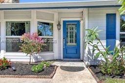 doorway to property featuring a porch