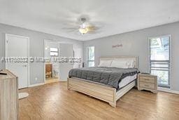 bedroom with wood finished floors and a ceiling fan