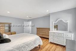 bedroom featuring wood finished floors