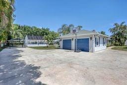 garage featuring driveway