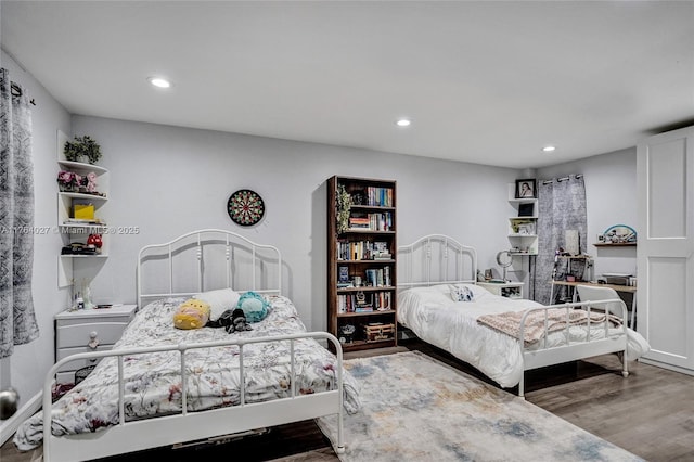 bedroom featuring recessed lighting and wood finished floors