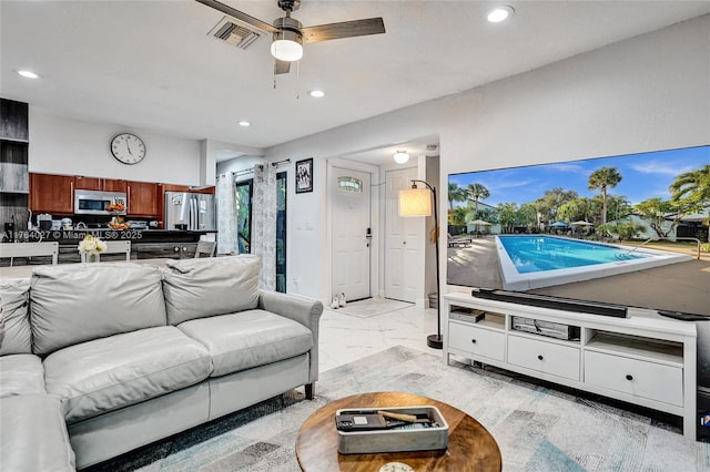 living room with recessed lighting, visible vents, marble finish floor, and ceiling fan