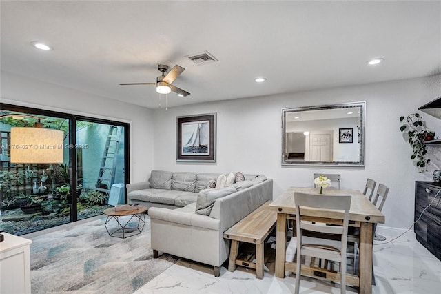 living area with recessed lighting, visible vents, marble finish floor, and a ceiling fan