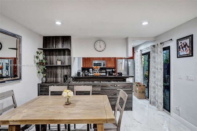 dining area featuring recessed lighting, baseboards, and marble finish floor