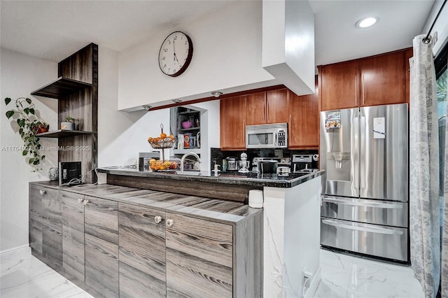 kitchen featuring marble finish floor, open shelves, dark countertops, stainless steel appliances, and a peninsula