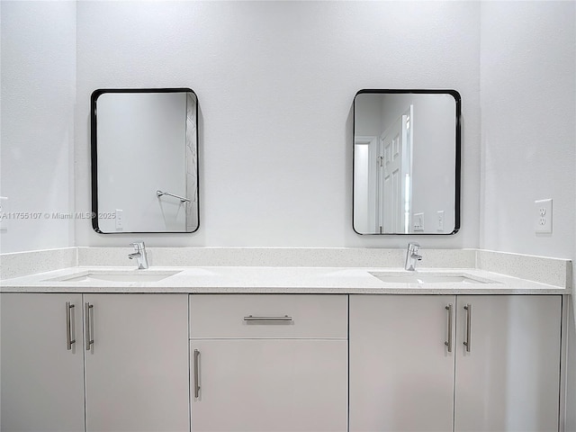 full bath featuring double vanity and a sink