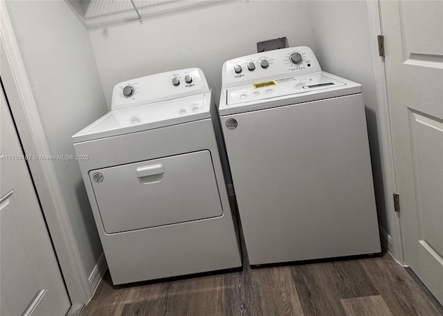 laundry room featuring laundry area, separate washer and dryer, and dark wood-type flooring