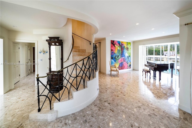 stairway featuring recessed lighting, baseboards, and ornamental molding