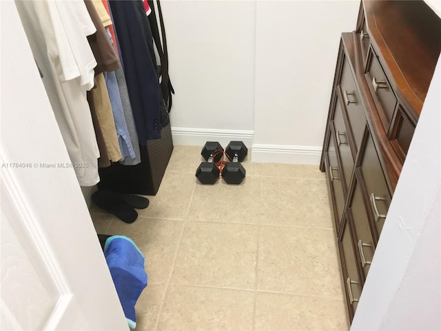 spacious closet with tile patterned flooring