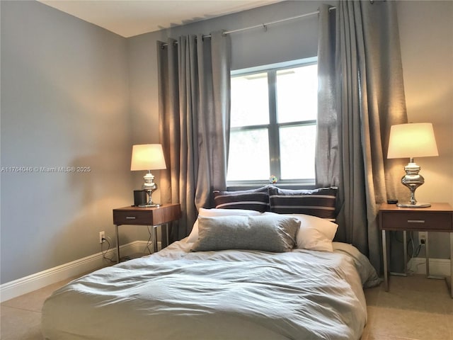 tiled bedroom with baseboards