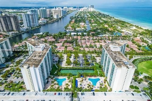 aerial view featuring a view of city and a water view