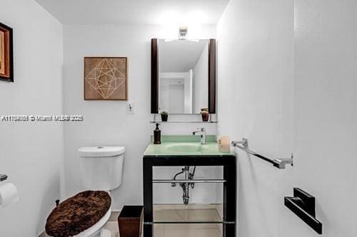 bathroom with toilet and vanity