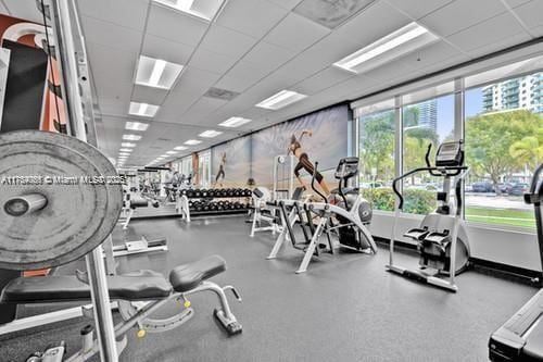 workout area featuring a drop ceiling