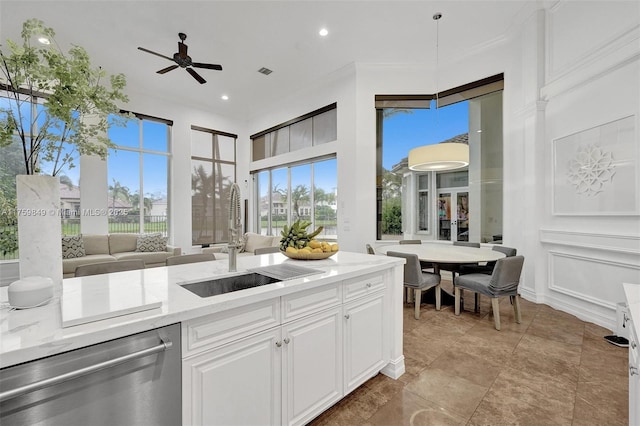 kitchen featuring visible vents, ceiling fan, a sink, white cabinets, and dishwasher