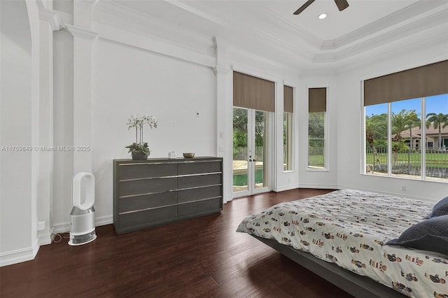 bedroom featuring wood finished floors, baseboards, recessed lighting, crown molding, and access to outside