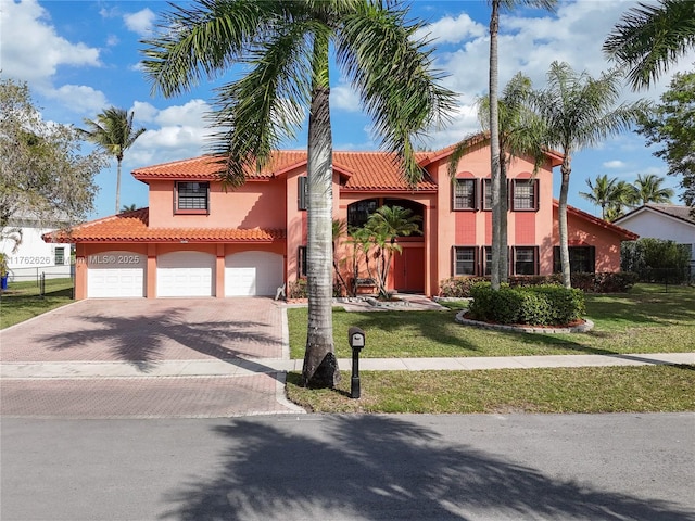 221 NW 201st Ave, Pembroke Pines, FL 33029 - mediterranean / spanish house featuring a tiled roof, decorative driveway, and stucco siding