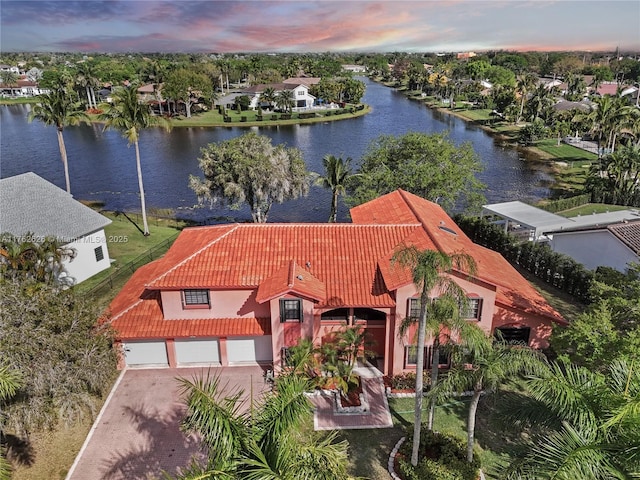 birds eye view of property with a water view