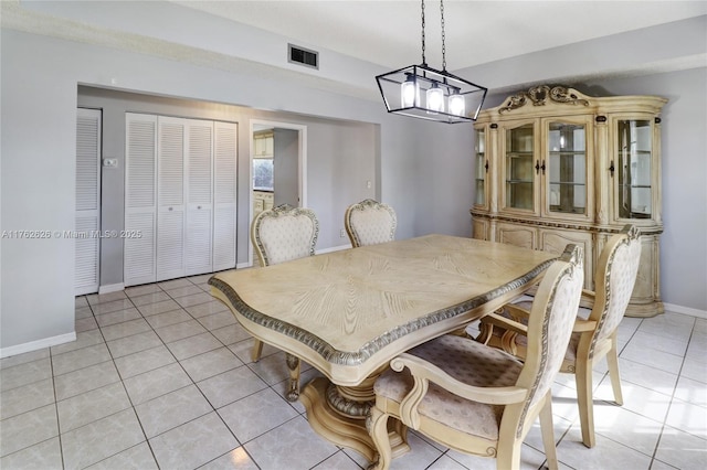 221 NW 201st Ave, Pembroke Pines, FL 33029 - dining space with light tile patterned floors, a chandelier, and baseboards