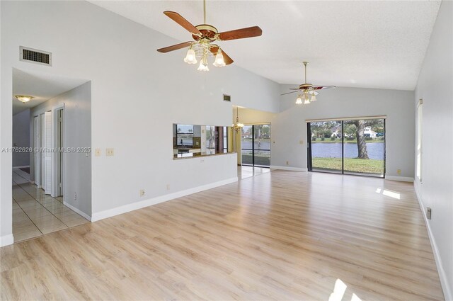 221 NW 201st Ave, Pembroke Pines, FL 33029 - unfurnished room featuring ceiling fan, high vaulted ceiling, baseboards, and light wood-style floors