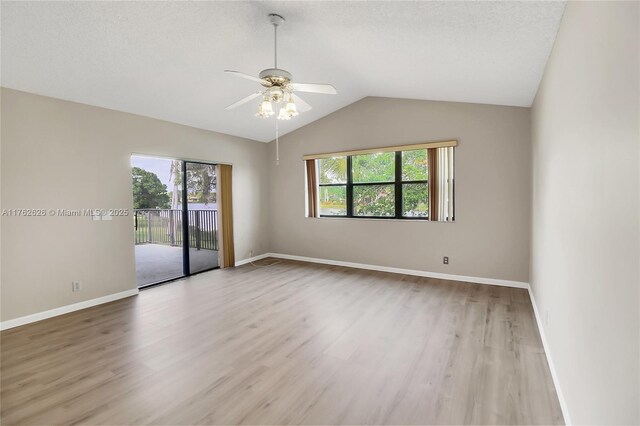221 NW 201st Ave, Pembroke Pines, FL 33029 - unfurnished room with a ceiling fan, wood finished floors, vaulted ceiling, and baseboards