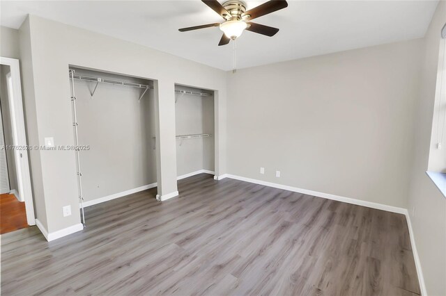 221 NW 201st Ave, Pembroke Pines, FL 33029 - unfurnished bedroom featuring wood finished floors, baseboards, and a ceiling fan