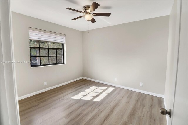 221 NW 201st Ave, Pembroke Pines, FL 33029 - unfurnished room featuring a ceiling fan, wood finished floors, and baseboards